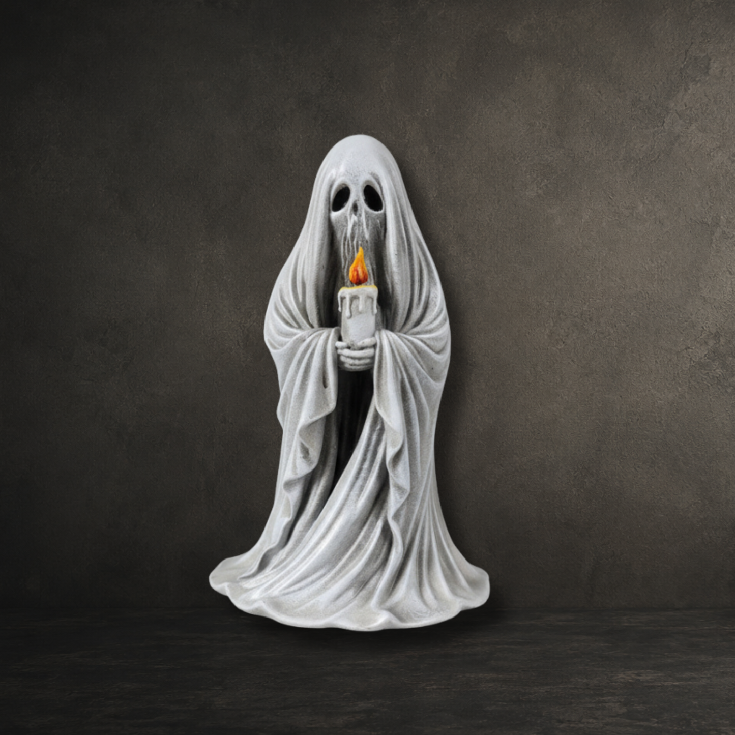 Hand-painted resin ghost ornament carrying a detailed candle