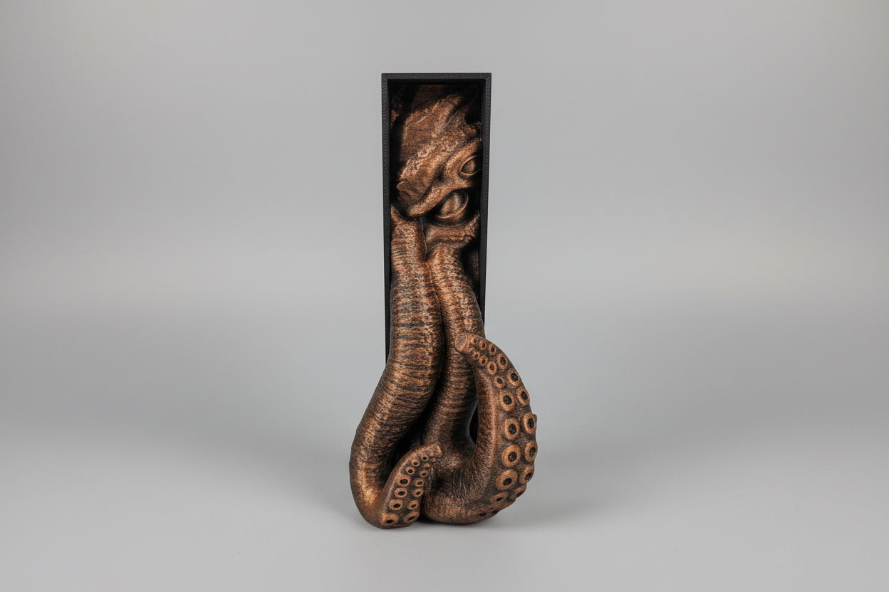 Side angle view of Cthulhu book nook showing depth, shadows and bronze hand painted finish