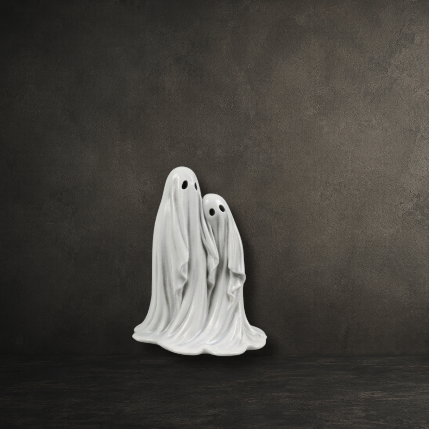 Hand painted resin figure of two friendly ghosts standing side by side, perfect for gothic home décor and ghost collections.