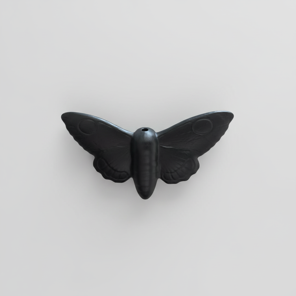 Alternative gothic light pull featuring a moth