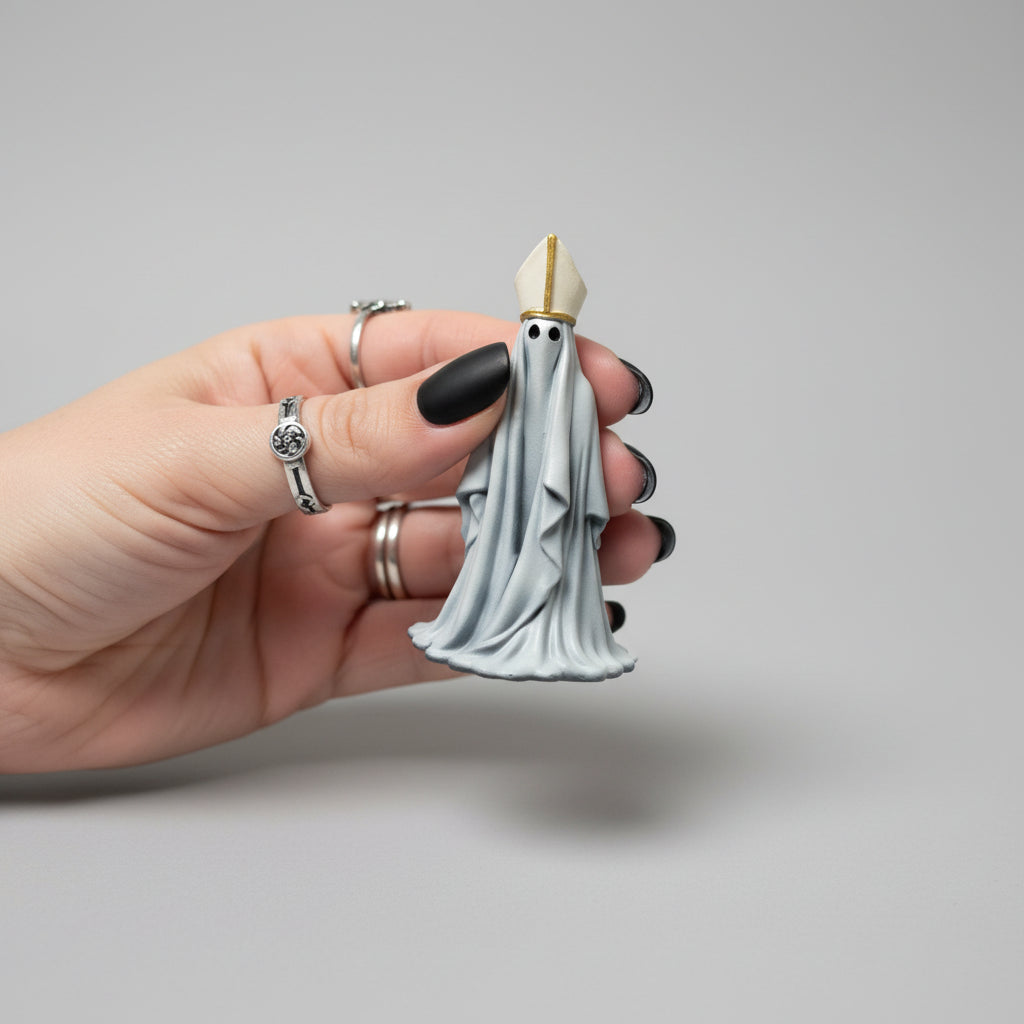 Small gothic Bishop ghost ornament displayed in hand.