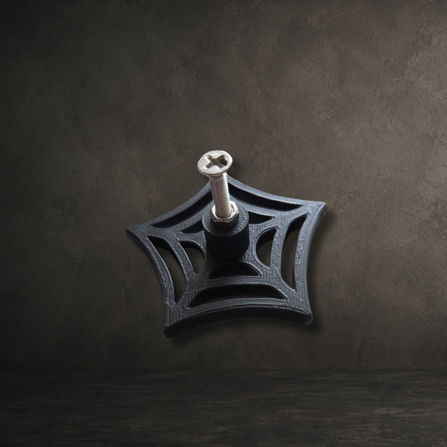 Detailed spider web drawer pull made from durable 3D printed PLA plastic for cabinets and cupboards.