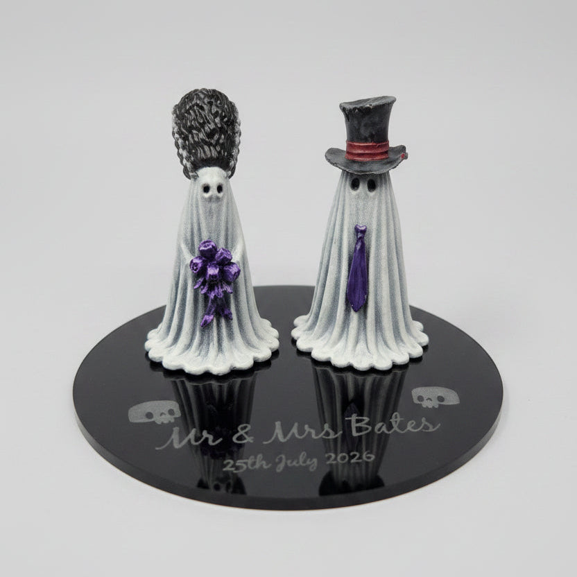 Alternative wedding cake topper featuring hand painted ghost bride and groom figurines