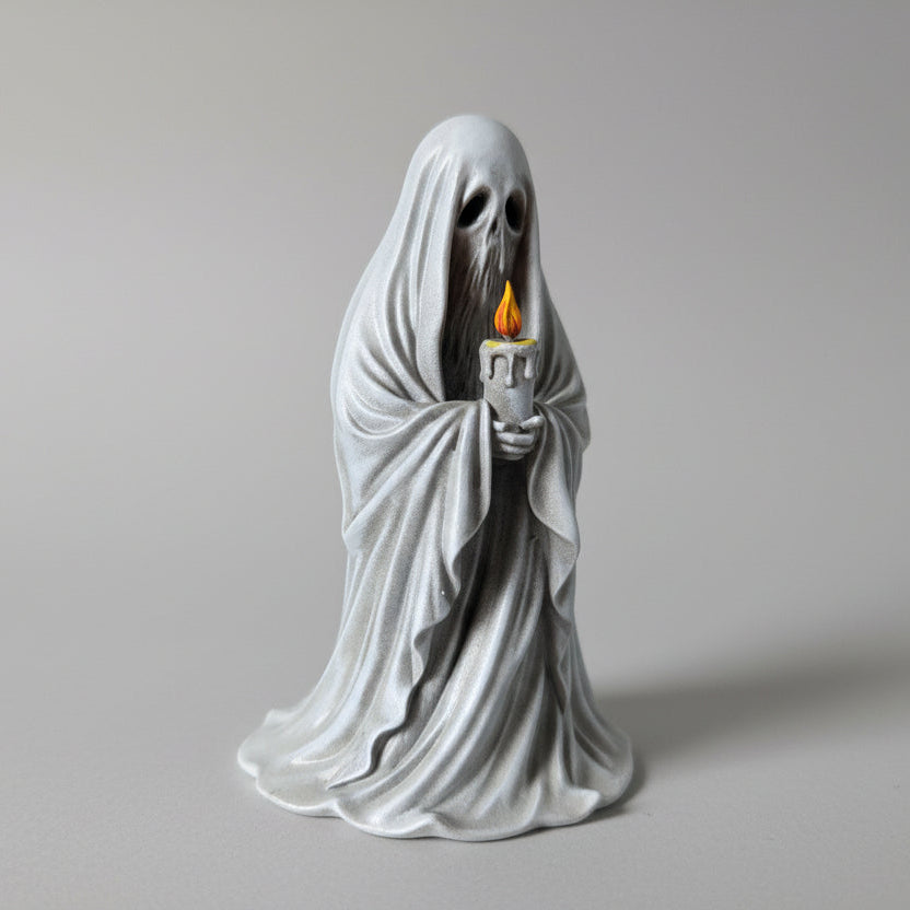 close up of ghost figurine holding candle highlighting face details and textured cloak