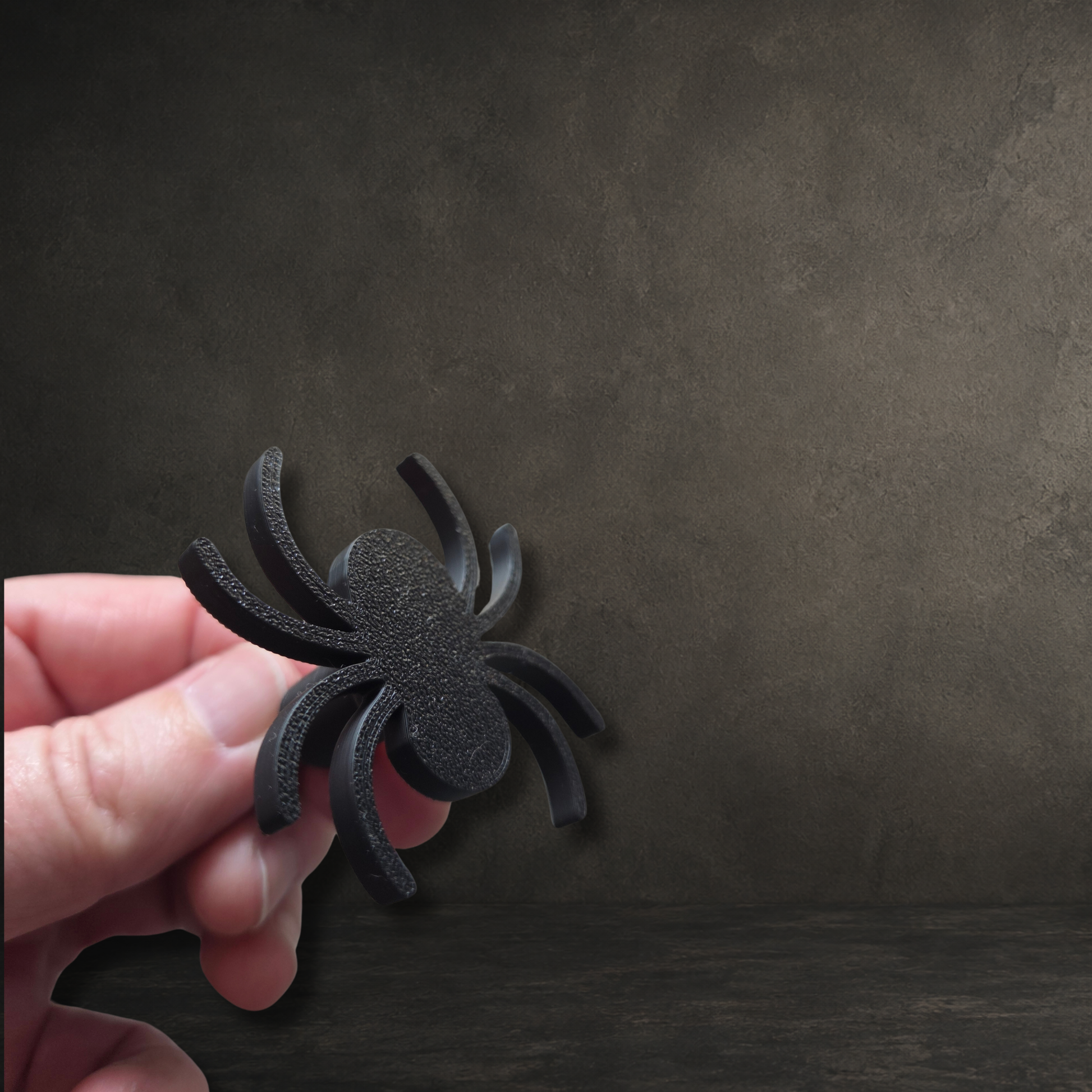 Black 3D printed spider cabinet pull handle with included M4 fixing screw for gothic furniture.