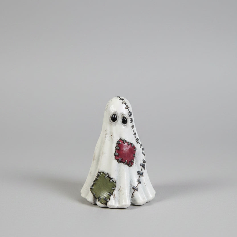 Front view of Mendrick patchwork ghost resin figure featuring wonky eyes and hand painted stitching