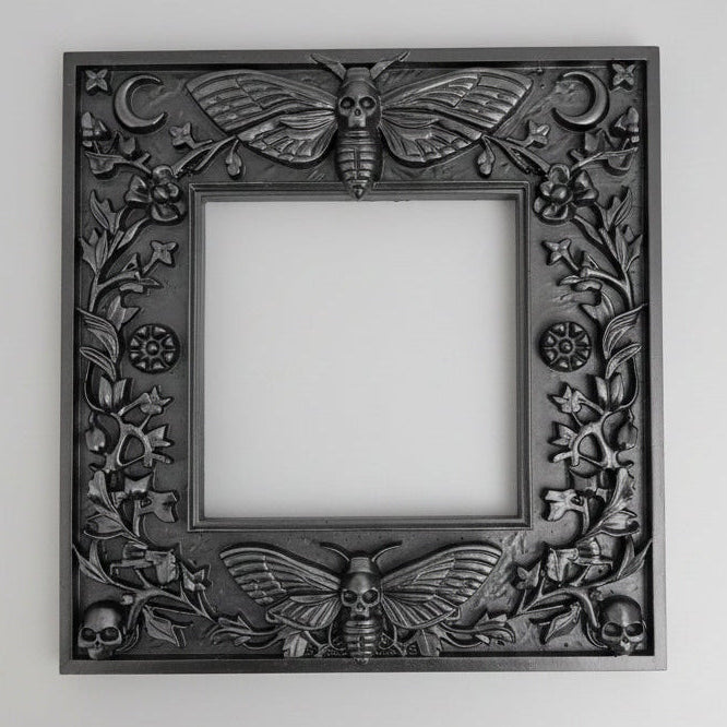 Alternative gothic home décor Death’s Head Moth light switch surround designed to transform plain UK wall switches.