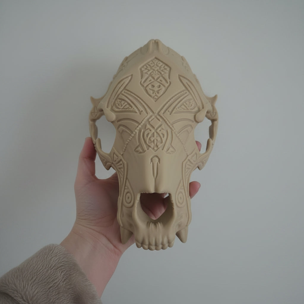 Side profile of a fantasy bear skull pauldron showing sculpted bone textures and carved decorative markings