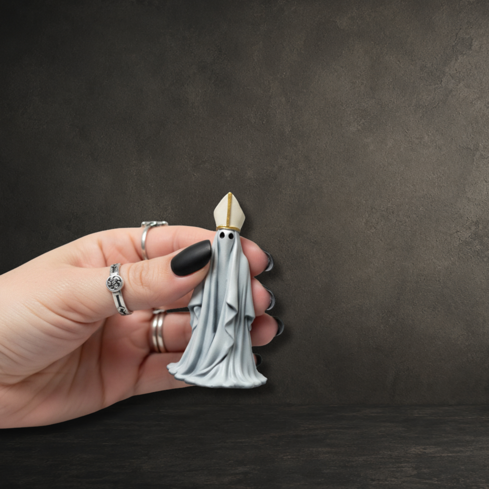 Hand-painted resin ghost ornament dressed in a traditional bishop's hat