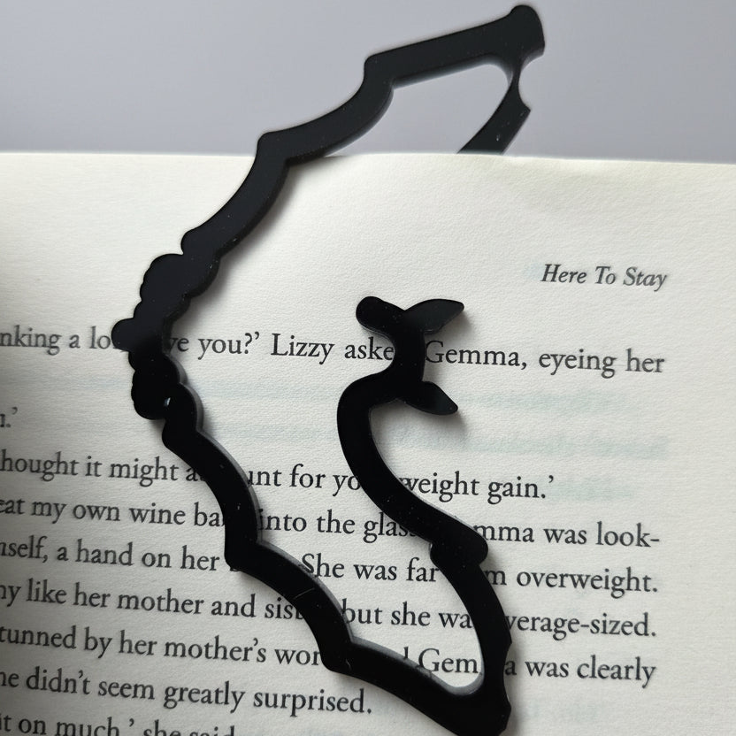 Black acrylic bat bookmark with a gothic design ideal for fantasy readers, Halloween fans and bookworms.