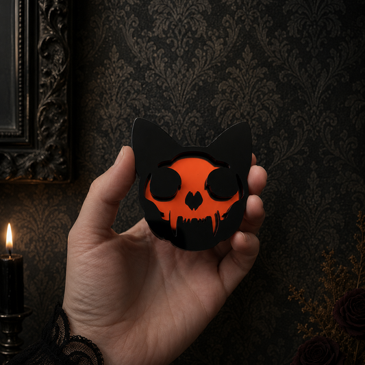 Black and red acrylic cat skull mirror featuring a striking gothic design, perfect for alternative home decor, gallery walls, and dark interiors.
