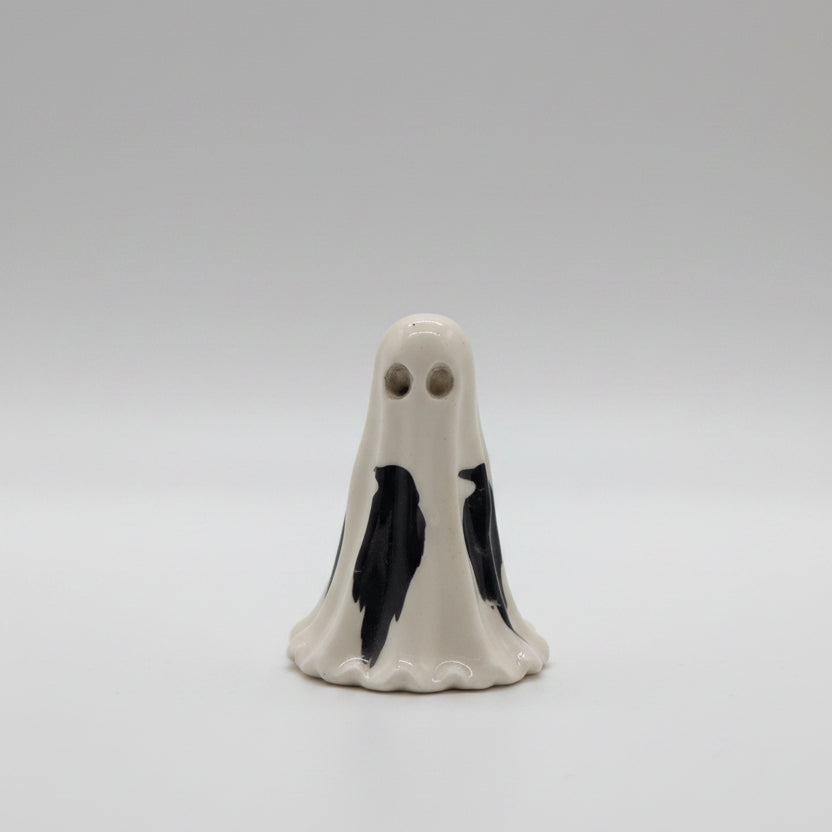 Close-up of The Blackfeather Spirit ghost ornament showing hollow eyes and raven detailing