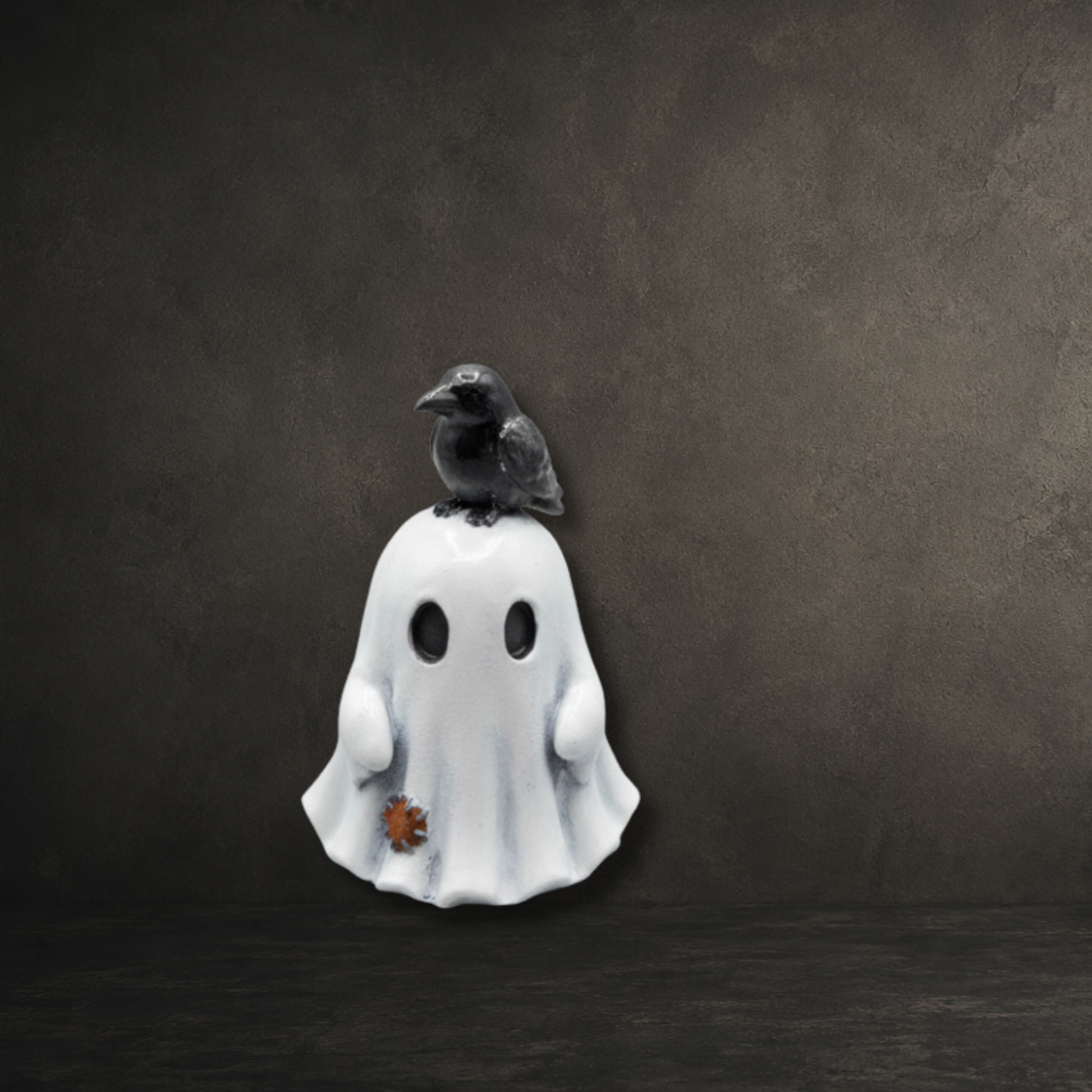Hand-painted resin ghost with a raven perched on its head