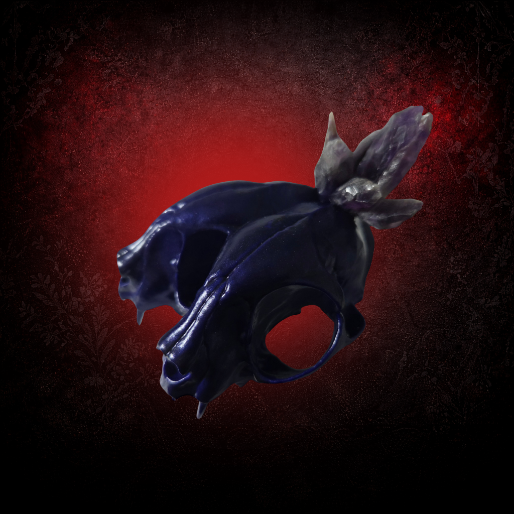 Deep purple conjoined cat skull with crystal crown