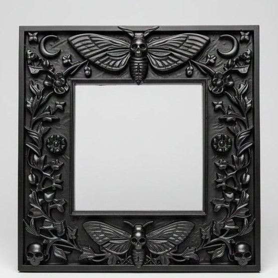 Death’s Head Moth light switch surround for UK square switches, black decorative wall frame with detailed moth wings and skull body design.