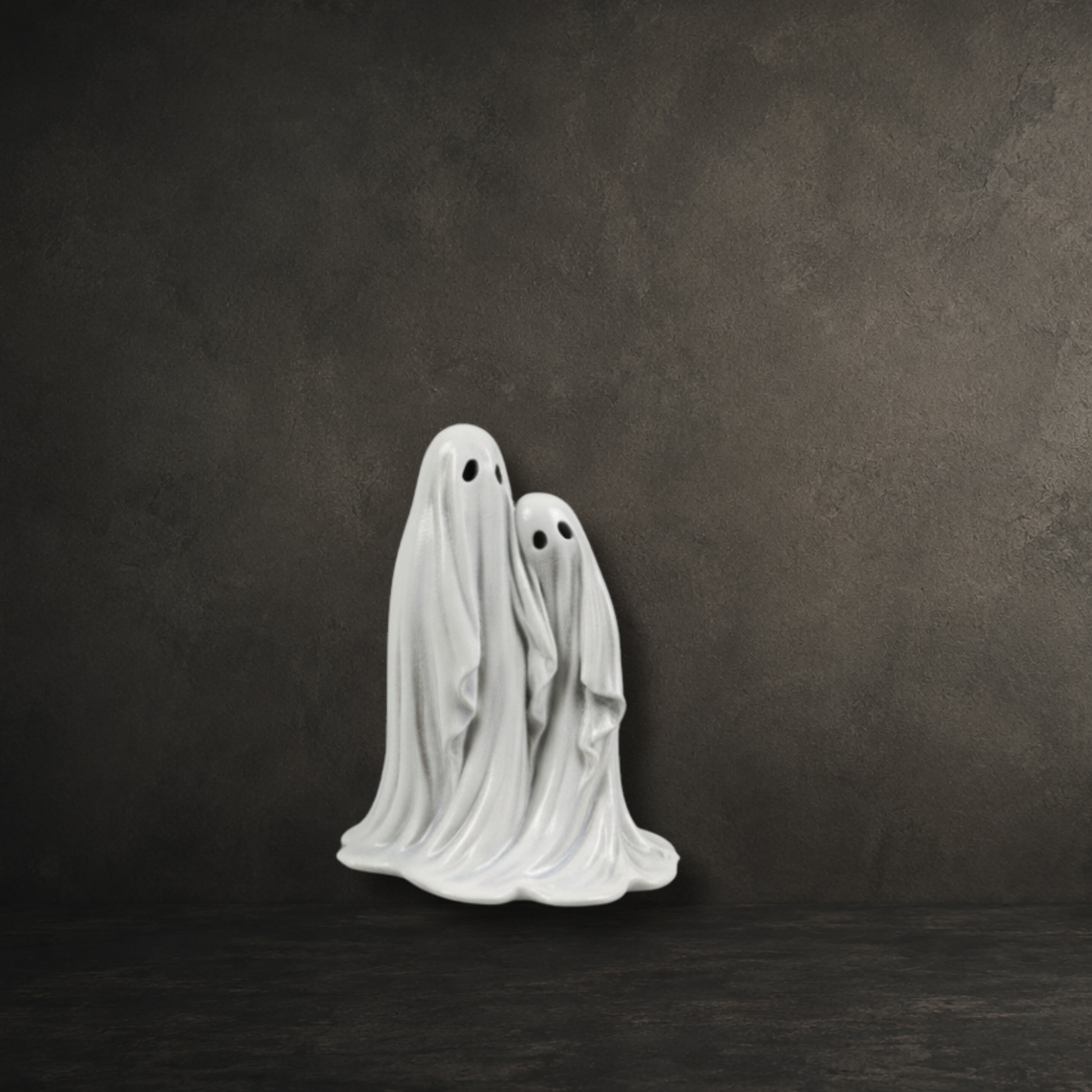Hand painted resin figure of two friendly ghosts standing side by side, perfect for gothic home décor and ghost collections.