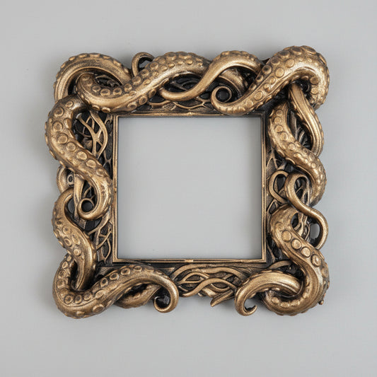 Gold gothic tentacle light switch surround for UK square switches with ornate octopus-inspired detailing