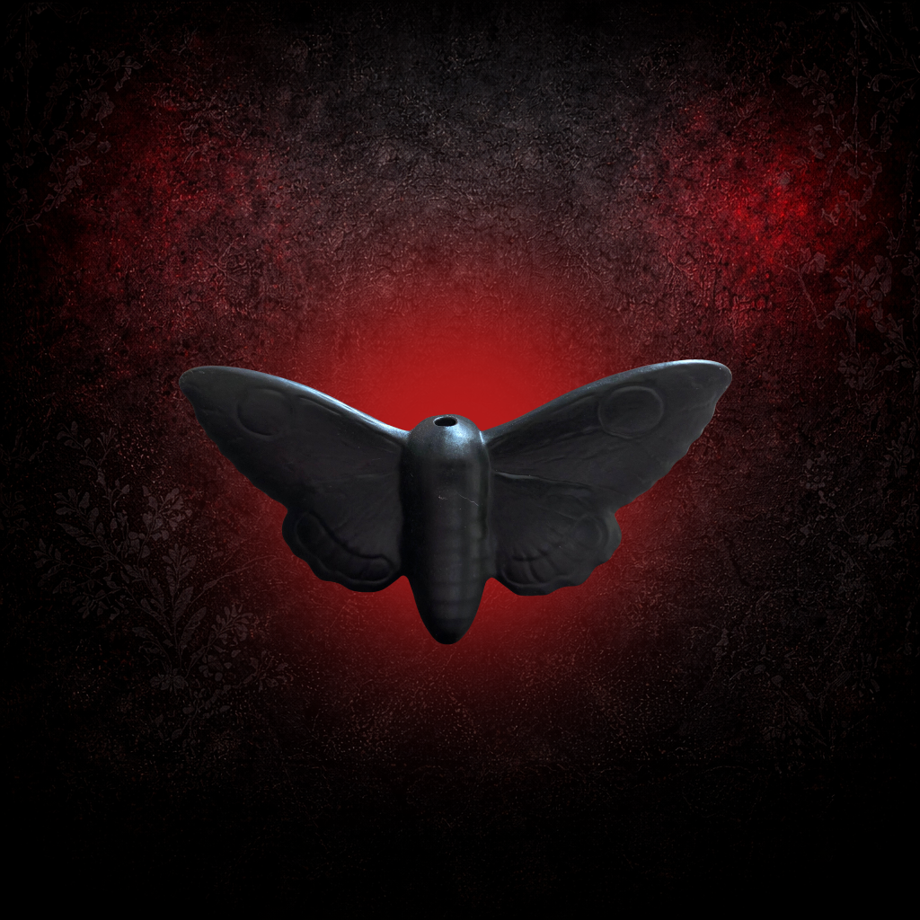 Alternative gothic light pull featuring a moth