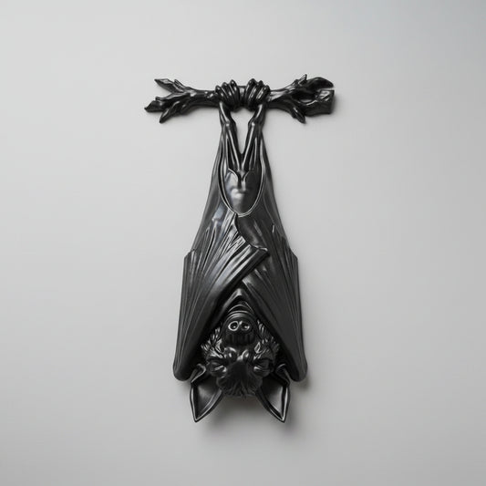 Resin gothic hanging bat wall decor in black finish shown hanging upside down front view