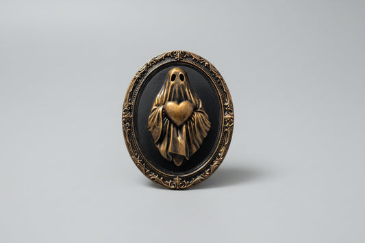 Gothic ghost frame holding a heart, dark romantic wall art with ornate frame design