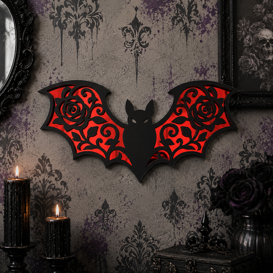 Black gothic bat wall mirror featuring intricate rose wing details with reflective red acrylic mirror panels, displayed on a stylish gothic feature wall.