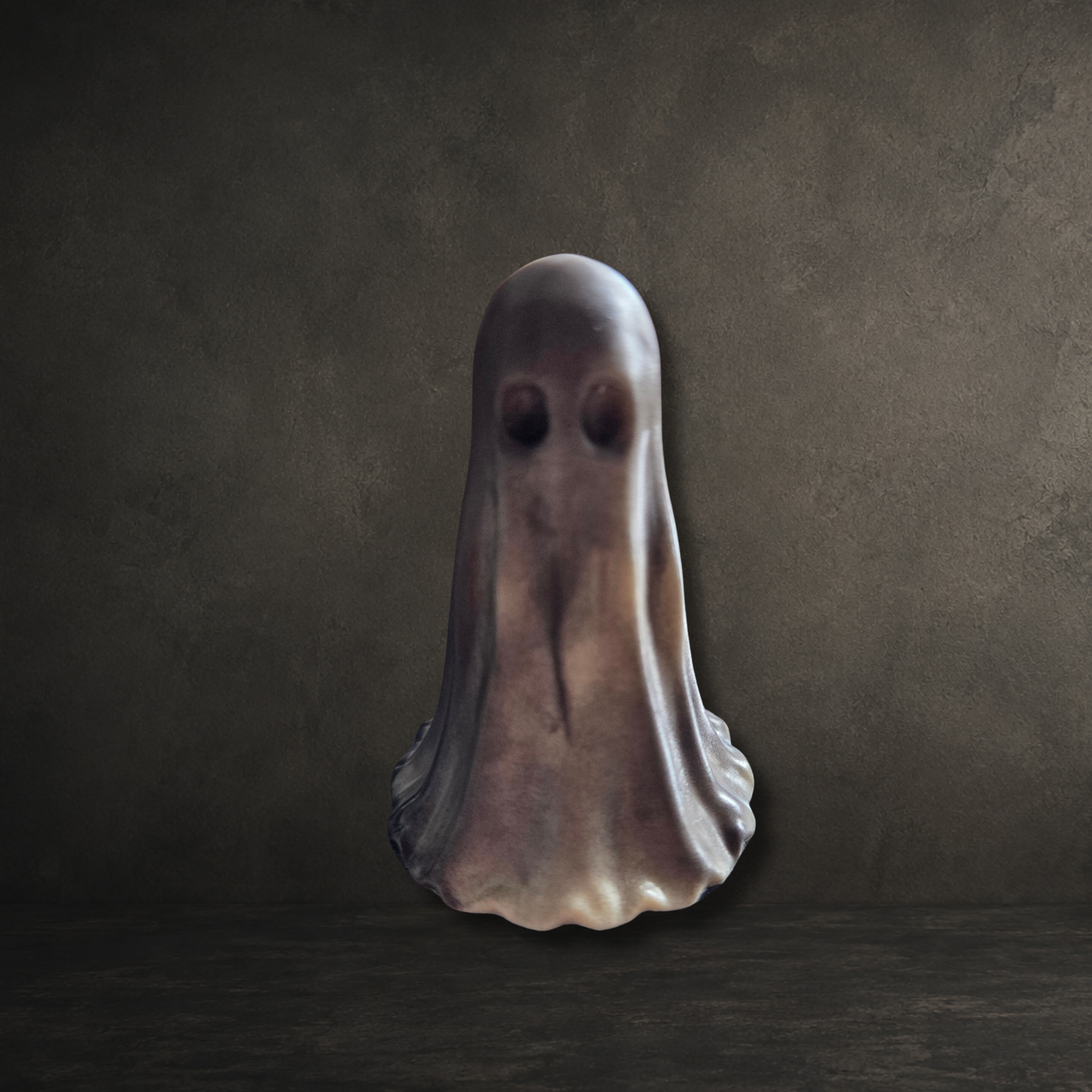 Handmade copper-infused resin ghost ornament with unique marbled finish for gothic home décor and Halloween displays.
