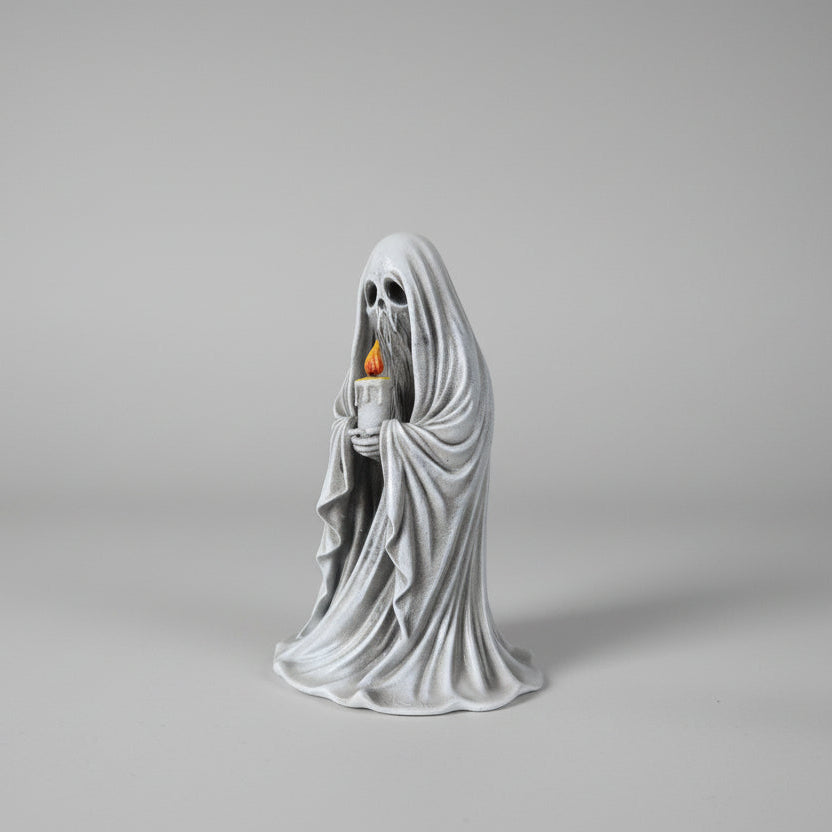 side view of gothic ghost ornament with candle showing sculpted folds and eerie silhouette