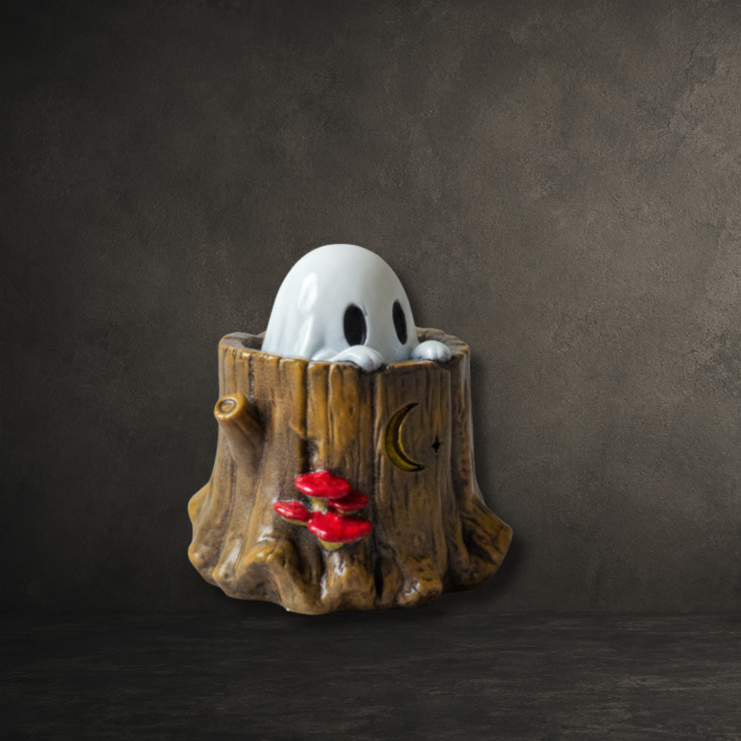 Hand-painted resin ghost peeking from a detailed tree stump ornament
