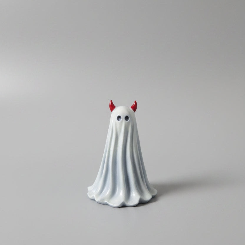 Little Malice gothic ghost figurine with red devil horns displayed on shelf
