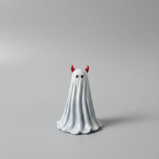 Little Malice gothic ghost figurine with red devil horns displayed on shelf