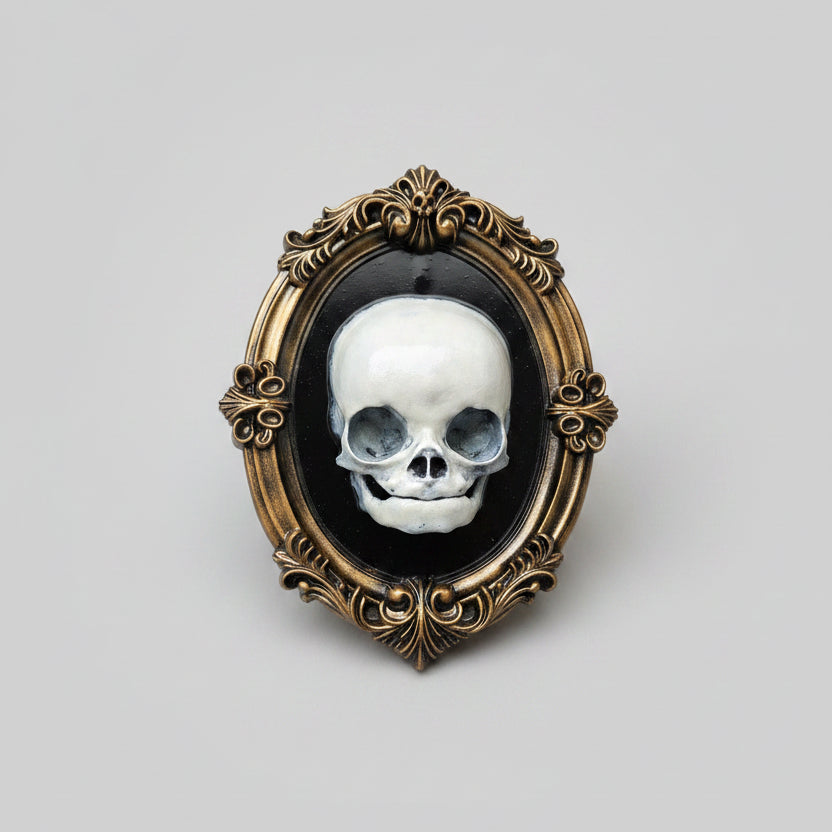Macabre fetus skull wall art in an antique bronze gothic frame for dark home decor