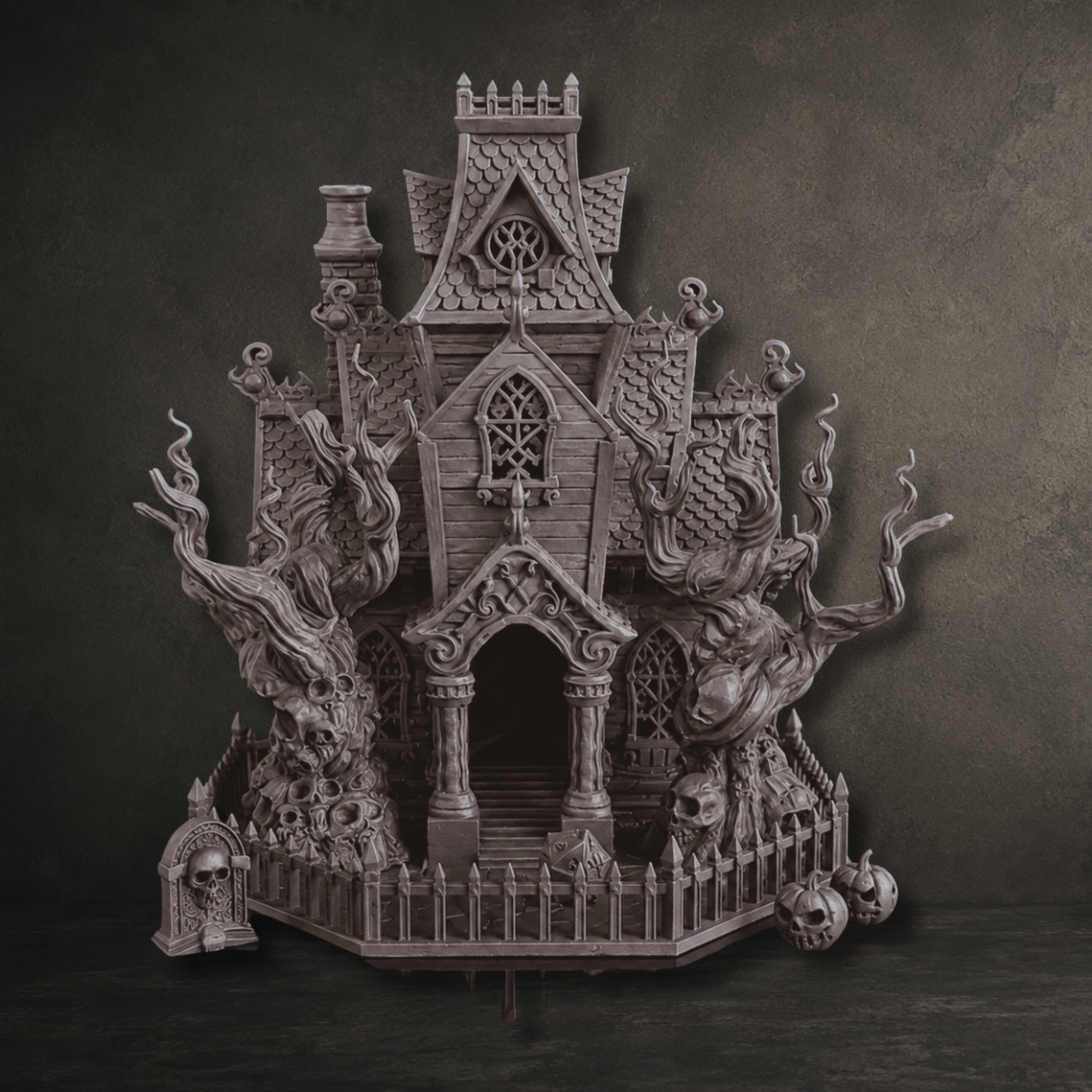 Macabre Mansion haunted house scene with gothic dice tower, twisted trees, gravestone and pumpkins in black.
