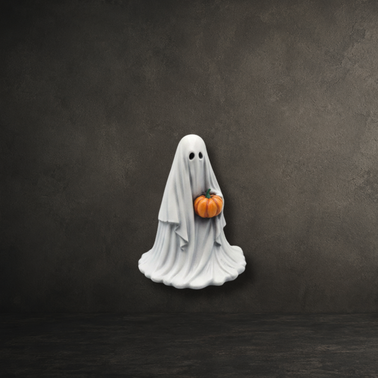 Original 6cm Pumpkinbearer ghost figurine from the Darkmoon Designs hand painted ghost collection holding a pumpkin.