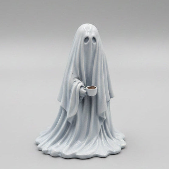 Side view of The Overworked resin ghost with coffee mug
