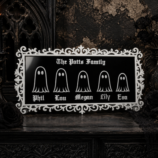 Personalised gothic ghost family plaque with custom family name and engraved ghost characters in a decorative black and white frame.