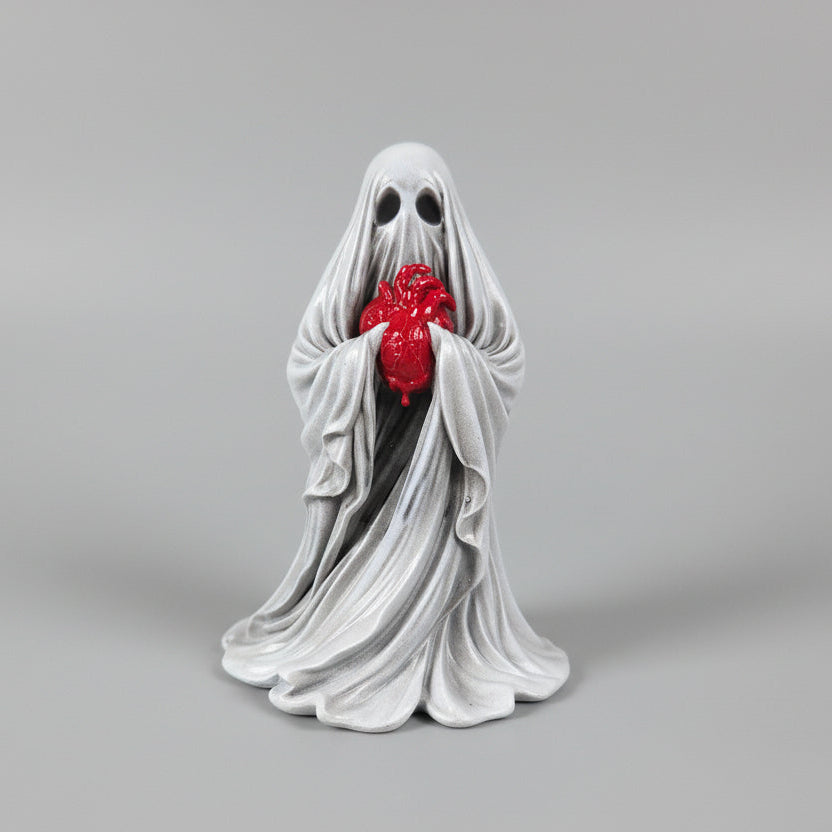 the reliquary ghost gothic figurine holding a detailed heart with flowing drapery