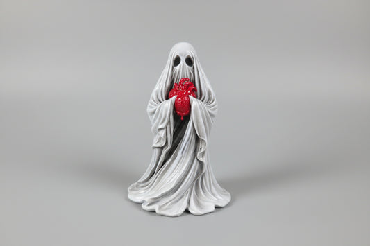 the reliquary ghost gothic figurine holding a detailed heart with flowing drapery