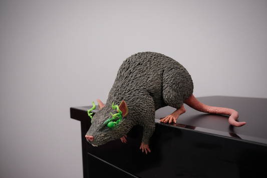 Gothic rat shelf ornament with glowing eyes
