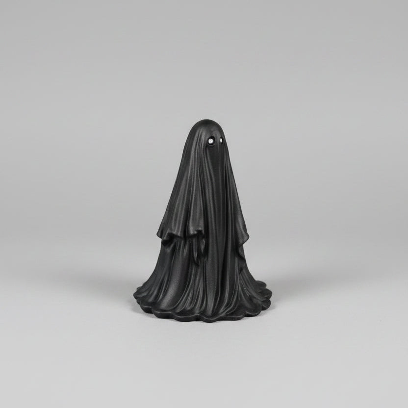 Side view of Silvergaze resin ghost figurine with black finish and silver eyes