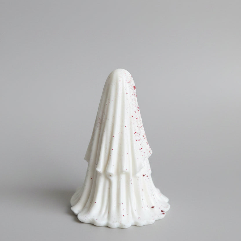 Side view of The Crimson Haunt resin ghost with flowing sheet detail and red splatter effect