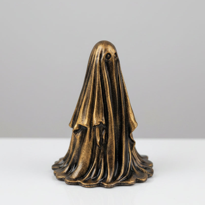 The Gilded Wraith gothic resin ghost displayed as part of a spooky home decor collection