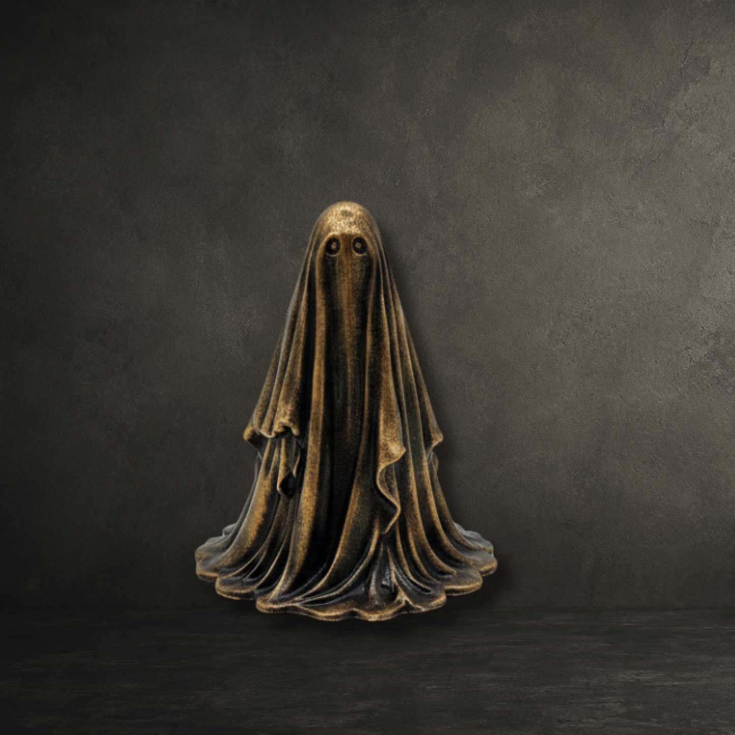 The Gilded Wraith gold ghost figurine from The First Haunting collection