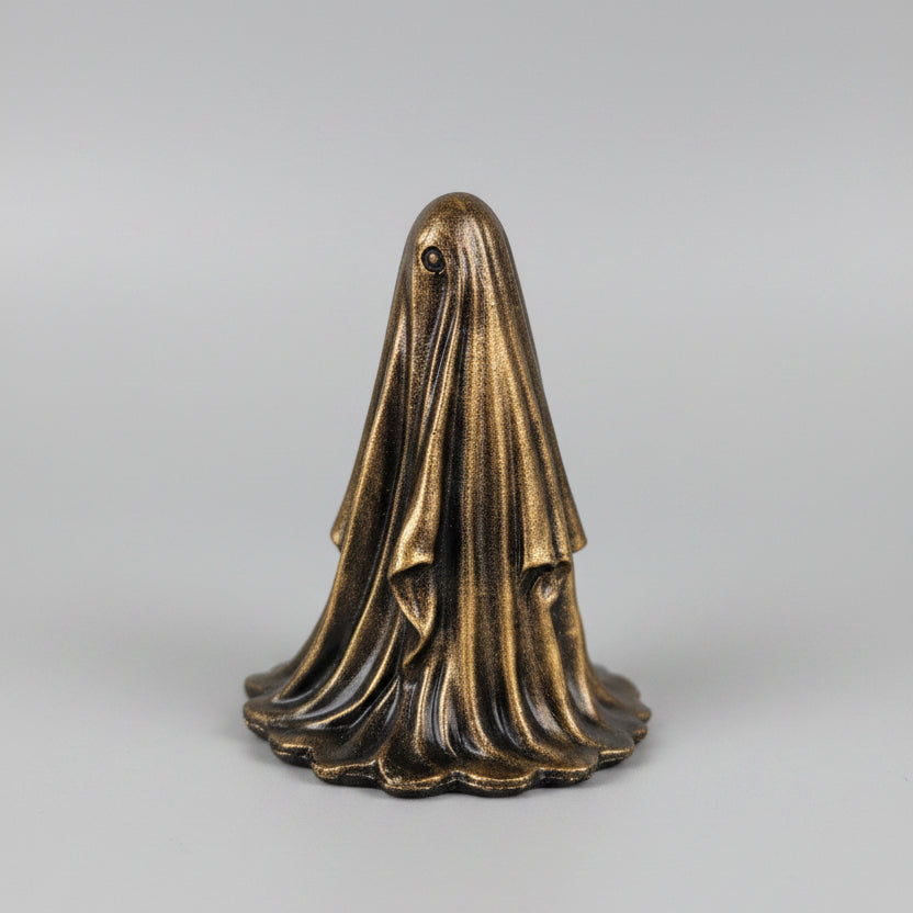 Side view of The Gilded Wraith gold ghost ornament showing detailed sculpted folds