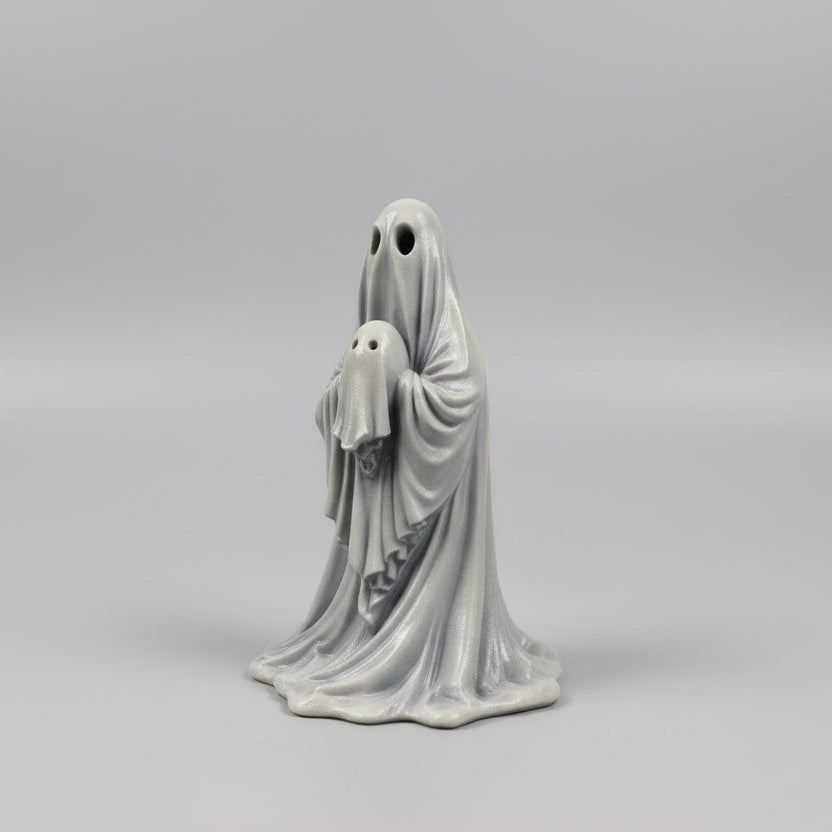 Close up of The Last Comfort ghost figurine showing facial details and draped folds