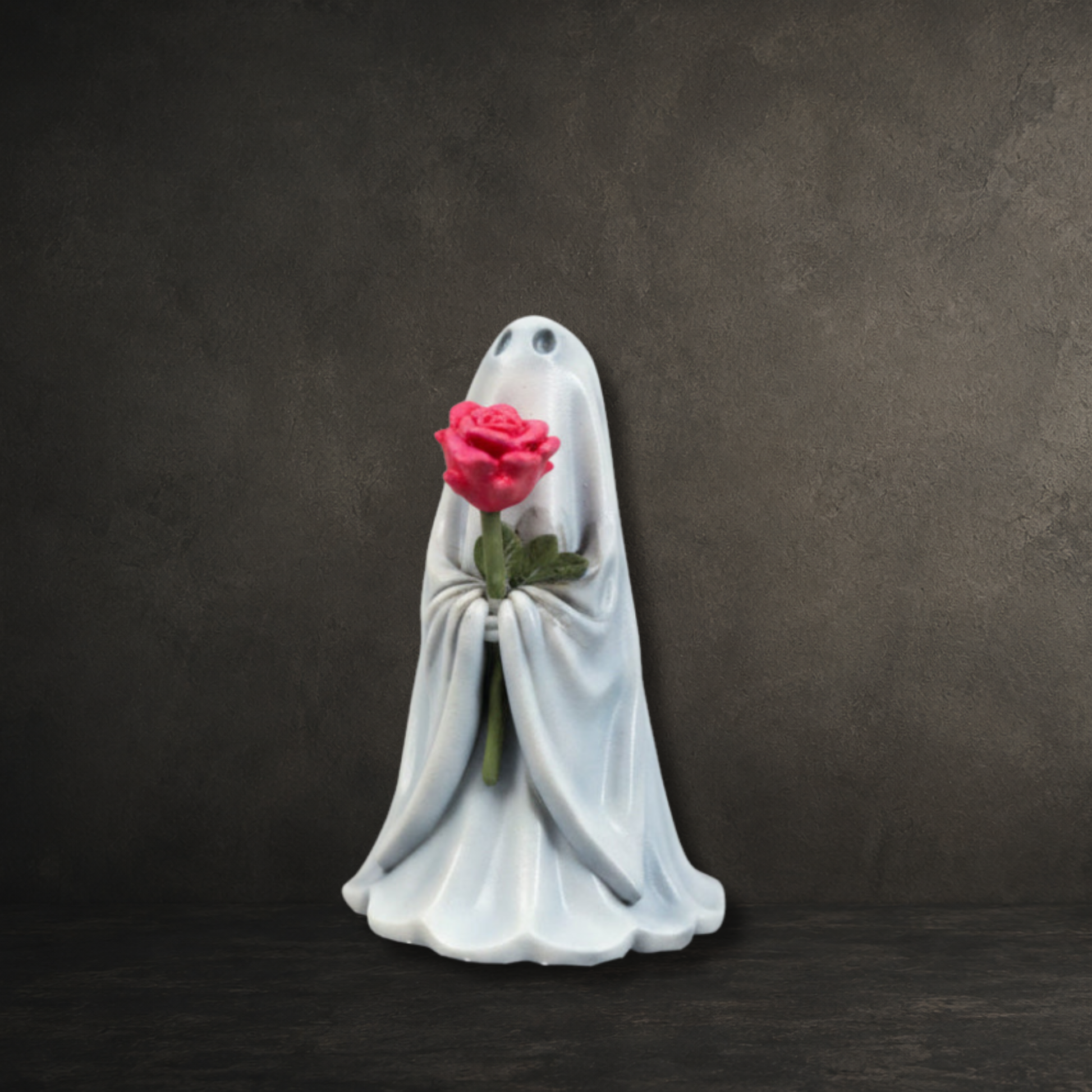 The Rosebearer lady ghost figurine holding a pink flower from The First Haunting collection