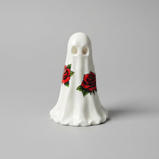 The Rosebound Haunt gothic resin ghost with red rose decals on white ghost figure