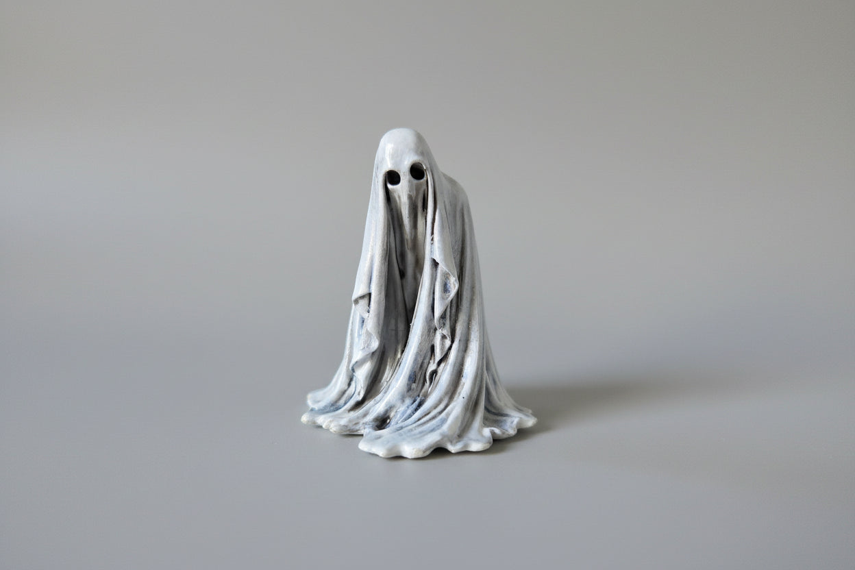 The Watcher gothic ghost figurine 6cm front view with hollow eyes and flowing draped form