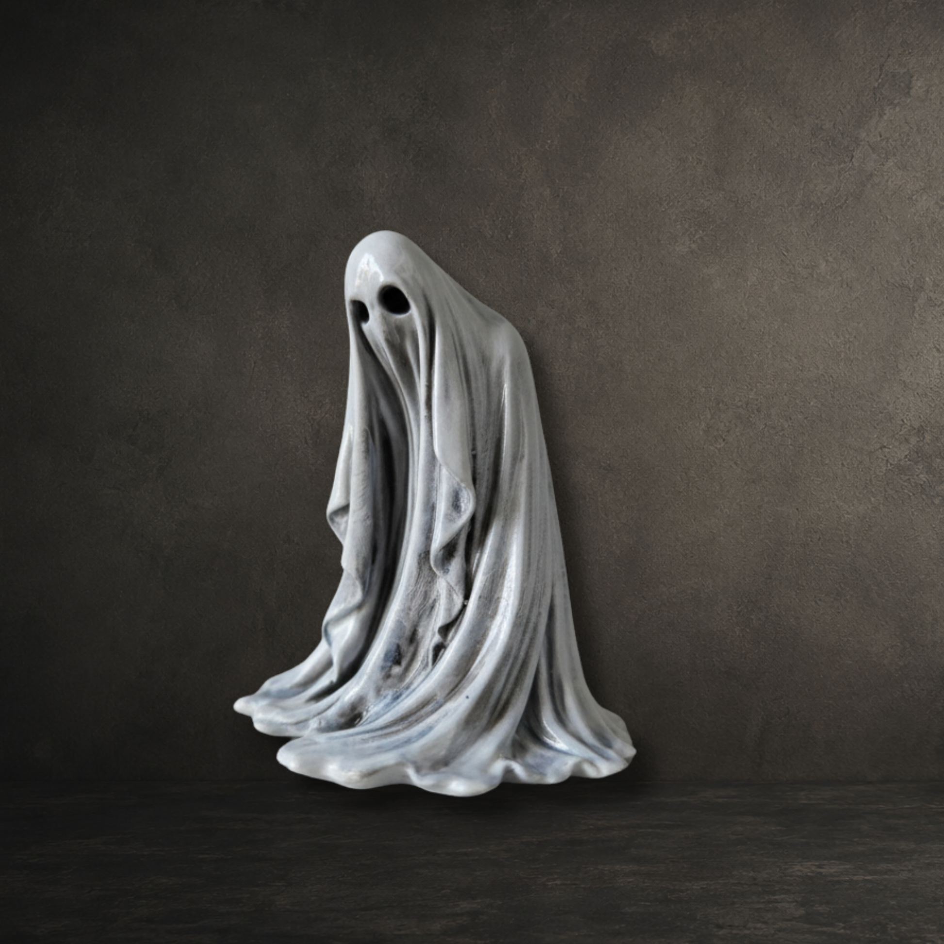 The Watcher hand painted 6cm resin ghost with a sinister downward gaze by Darkmoon Designs.