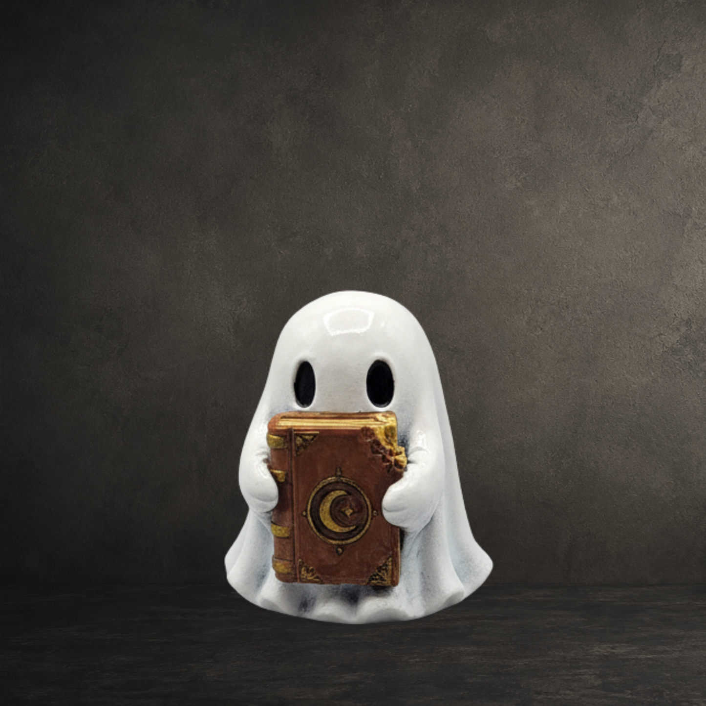 Hand-painted resin ghost holding an enchanted spellbook