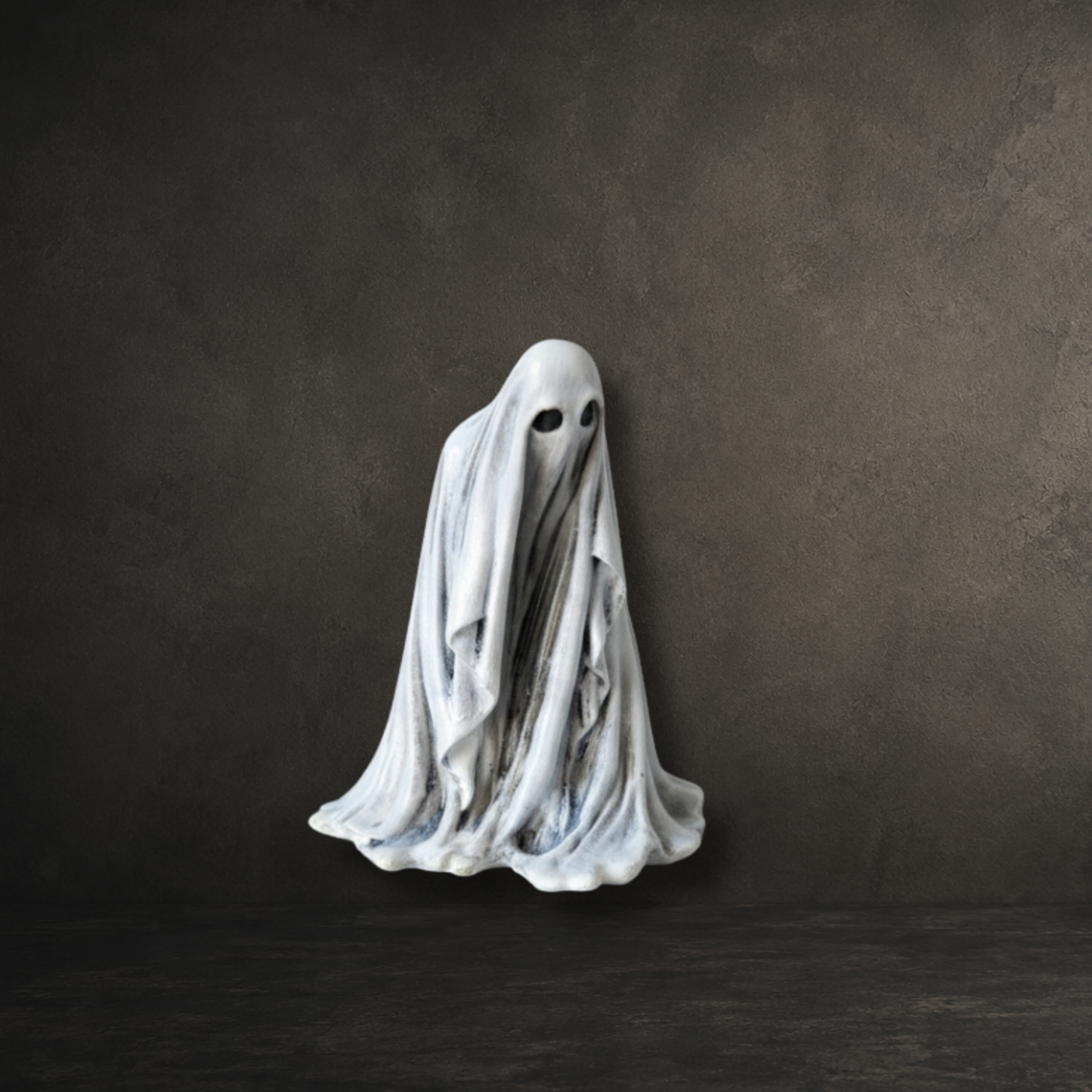 Hand painted resin ghost with a watchful expression, perfect for gothic home décor and ghost collections.